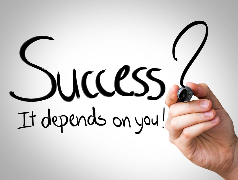 "Success, it depends on you" Hand writing with black marker on transparent wipe board