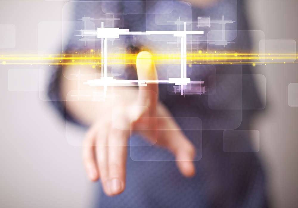 Tech woman touching button with orange light beams concept